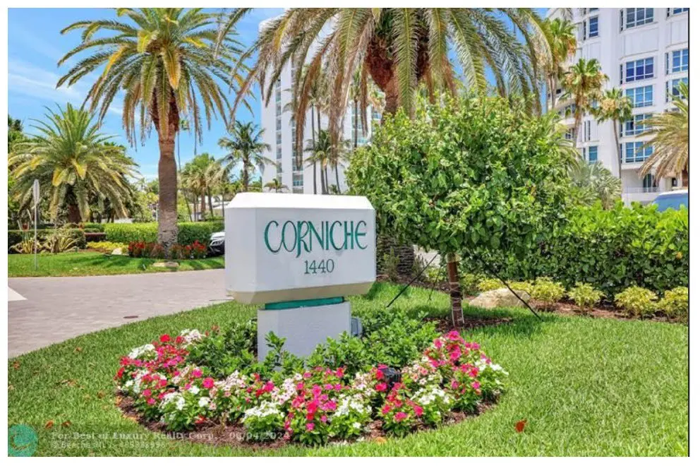 1 A sign in the middle of a flower garden.
